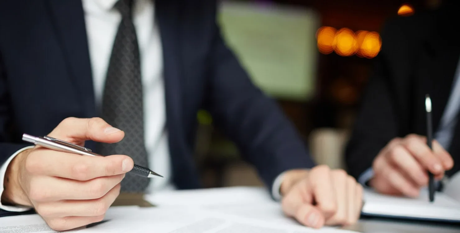 unfair dismissal employer reading legal document